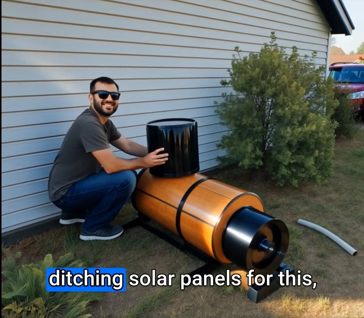 Mark Reynolds, 62, standing in his garage workshop next to the compact device